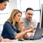 Group of business people and software developers working as a te
