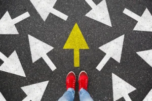 Person standing on the road to future life with many direction sign point in different ways and only yellow one. Decision making is very hard, but you have a choice and right way