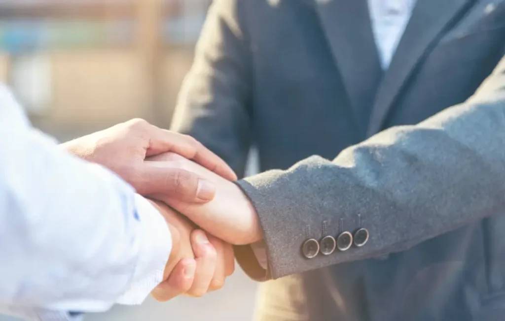 the-art-of-the-handshake-how-genuine-human-connection-rebuilds-trust-during-leadership-transitions