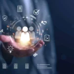Businessman holding digital icons of people and team management, representing human resources, recruitment, employee data, business leadership, and digital HR solutions.