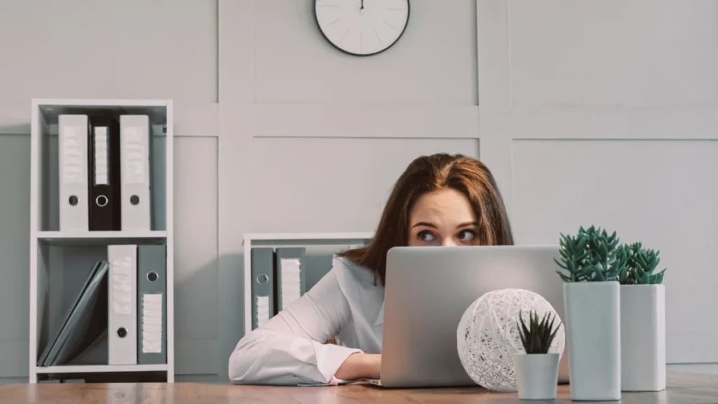 Hiding freelancer laptop hiding lazy woman scared
