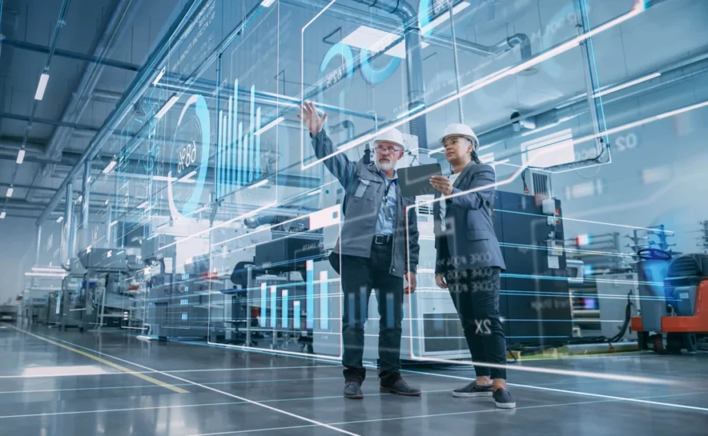 Factory Digitalization: Two Industrial Engineers Use Tablet Comp