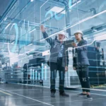 Factory Digitalization: Two Industrial Engineers Use Tablet Comp