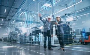 Factory Digitalization: Two Industrial Engineers Use Tablet Comp