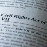 Civil Rights Act of 1964 Title VII written in business textbook