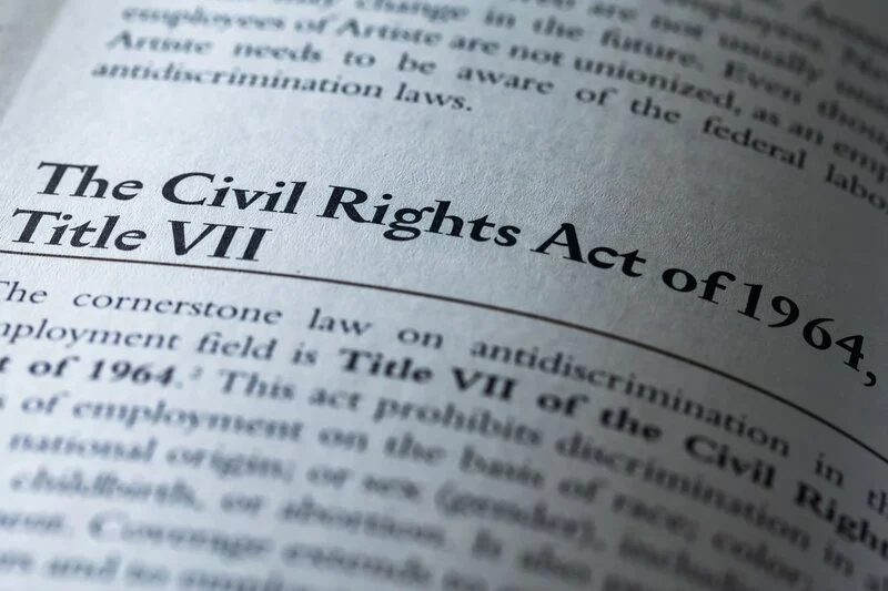 Civil Rights Act of 1964 Title VII written in business textbook