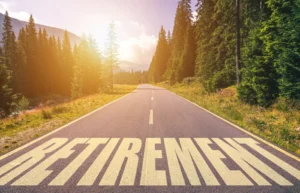 Retirement word written on road in the mountains