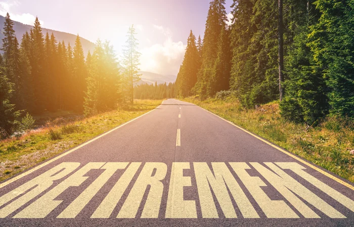Retirement word written on road in the mountains