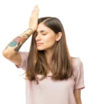 Woman Realizing Mistake And Keeping Hand On Head