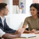 Confident african female applicant talking to diverse hr managers