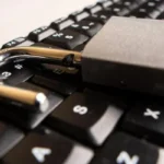 Close up to An open padlock on a computer keyboard