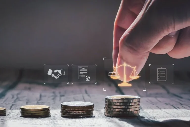 A hand stacking coins beside justice scale icons, symbolizing financial growth, investment fairness, and legal business decisions in a professional setting.
