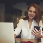 Attractive female international student testing new software for