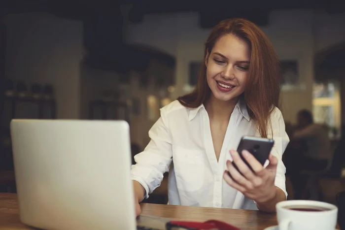 Attractive female international student testing new software for