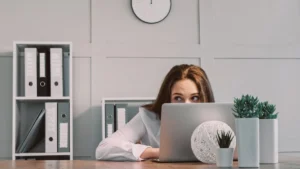 Hiding freelancer laptop hiding lazy woman scared