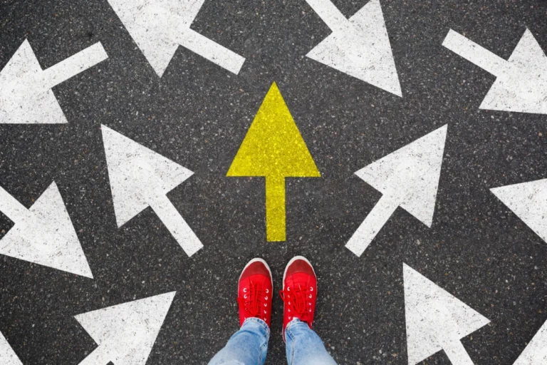 Person standing on the road to future life with many direction sign point in different ways and only yellow one. Decision making is very hard, but you have a choice and right way